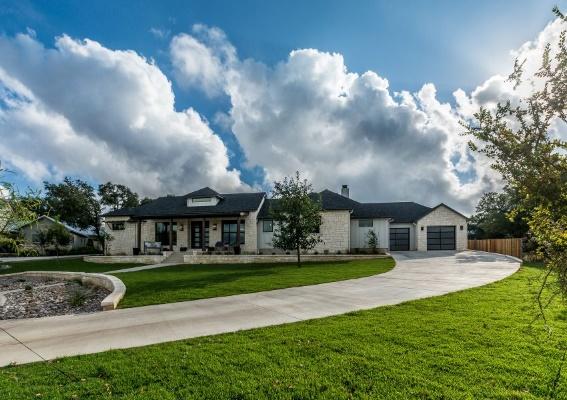 single story texas home with driveway and yard