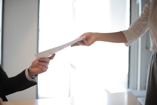 hands exchanging texas law documents