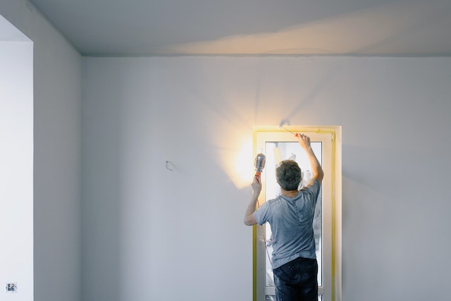 masculine-landlord-texas-rental-fixing-lightbulb-repairs-maintenance